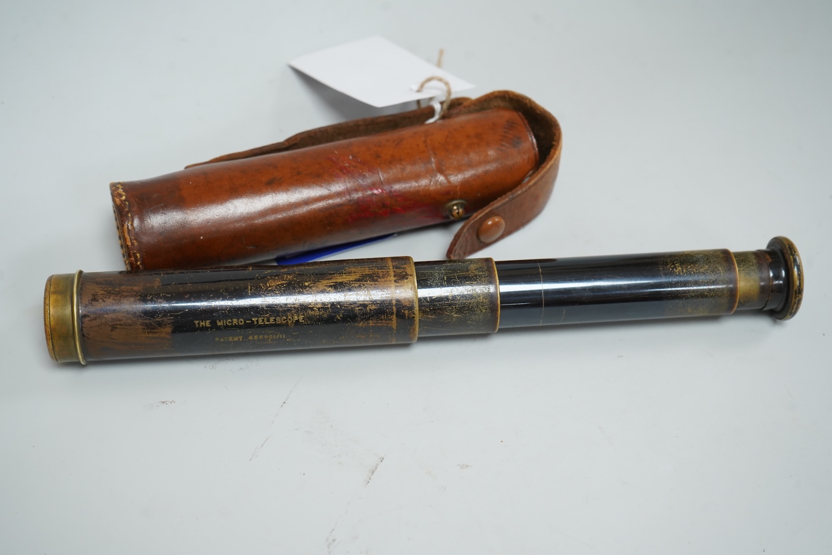A Pietra Dura inkstand, telescope, cased glass flask and a wood boat model